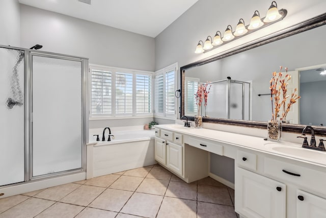 9515 Willow Crossing Dr, Houston, TX 77064 - bathroom featuring a shower stall, double vanity, a bath, and tile patterned flooring