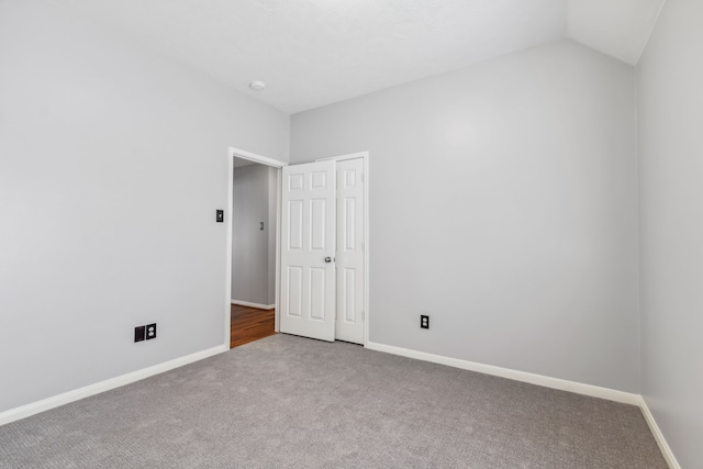 9515 Willow Crossing Dr, Houston, TX 77064 - unfurnished bedroom with carpet flooring, baseboards, and vaulted ceiling
