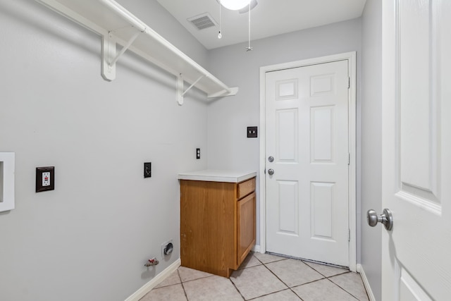 9515 Willow Crossing Dr, Houston, TX 77064 - washroom featuring hookup for a gas dryer, light tile patterned flooring, and baseboards