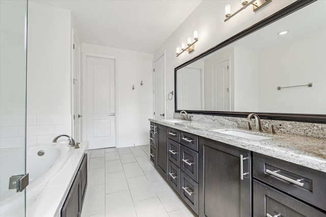 6123 Stillman St, Houston, TX 77007 - full bath featuring double vanity, a garden tub, tile patterned floors, and baseboards