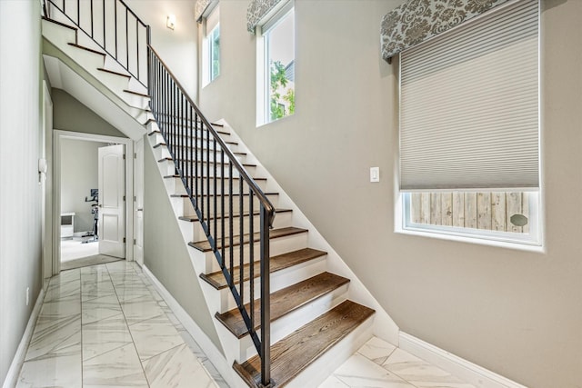 6123 Stillman St, Houston, TX 77007 - stairway with marble look tiles and baseboards
