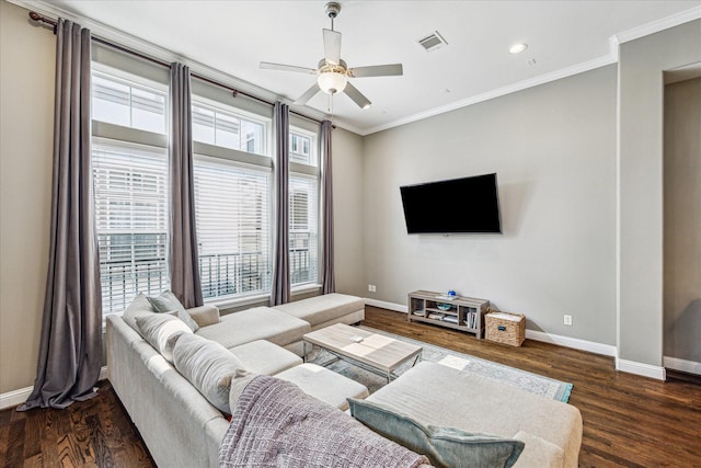 6123 Stillman St, Houston, TX 77007 - living area with plenty of natural light, crown molding, baseboards, ceiling fan, and wood finished floors