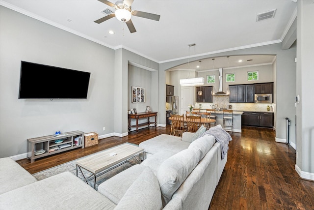 6123 Stillman St, Houston, TX 77007 - living area featuring ceiling fan, crown molding, dark wood-style flooring, recessed lighting, and baseboards
