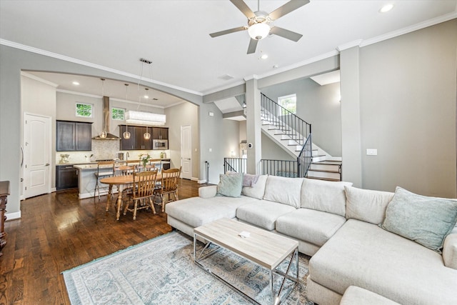 6123 Stillman St, Houston, TX 77007 - living room featuring ceiling fan, recessed lighting, dark wood-style floors, stairs, and ornamental molding