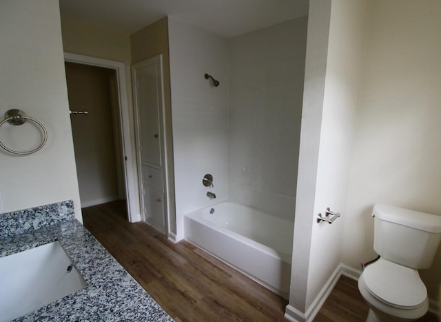 1215 Maplewood Ln, Pasadena, TX 77502 - full bathroom with wood finished floors, vanity, toilet, and  shower combination