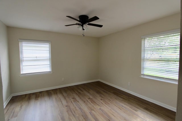 1215 Maplewood Ln, Pasadena, TX 77502 - unfurnished room featuring wood finished floors, a ceiling fan, and baseboards
