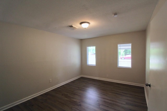 1215 Maplewood Ln, Pasadena, TX 77502 - empty room featuring dark wood finished floors, baseboards, and a smoke detector