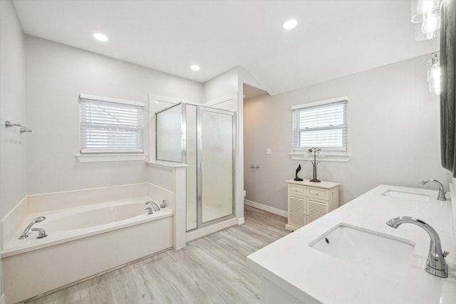 22409 Vista Del Mar, Galveston, TX 77554 - full bathroom with a stall shower, a garden tub, wood finished floors, double vanity, and recessed lighting