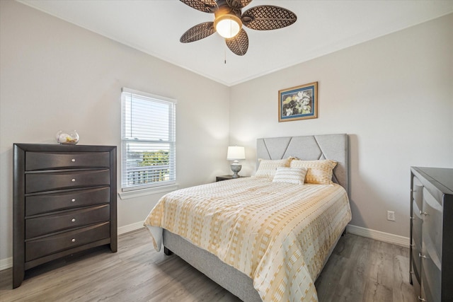 22409 Vista Del Mar, Galveston, TX 77554 - bedroom with baseboards, light wood finished floors, and ceiling fan