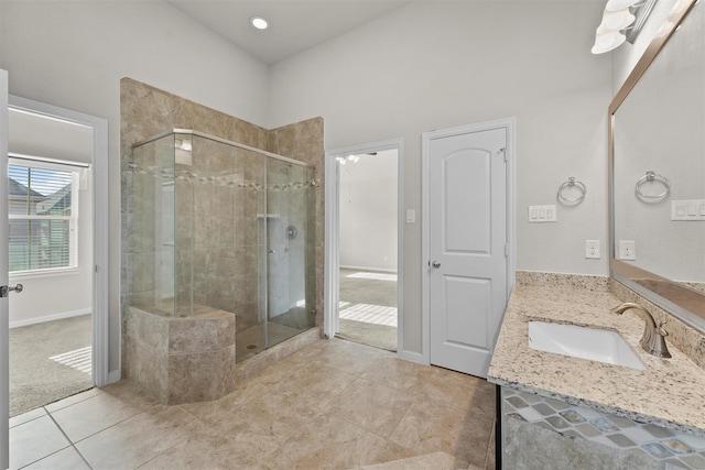 9611 Knights Station Dr, Houston, TX 77045 - full bath with a stall shower, vanity, tile patterned flooring, and baseboards