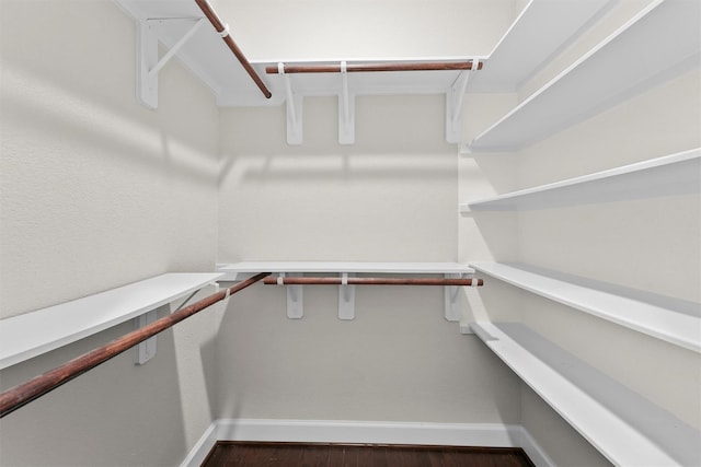 9611 Knights Station Dr, Houston, TX 77045 - walk in closet featuring wood finished floors