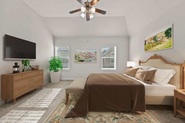 9611 Knights Station Dr, Houston, TX 77045 - bedroom featuring vaulted ceiling, multiple windows, light carpet, ceiling fan, and baseboards