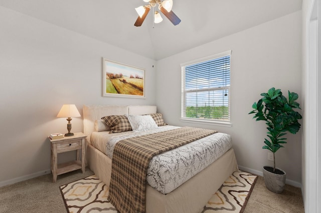 9611 Knights Station Dr, Houston, TX 77045 - carpeted bedroom featuring baseboards, lofted ceiling, and ceiling fan