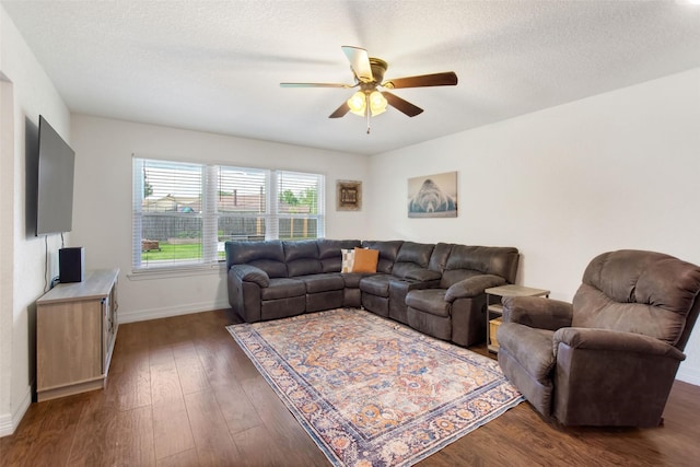 24 Wagon Lane Loop, Angleton, TX 77515 - living area with ceiling fan, wood finished floors, baseboards, and a textured ceiling