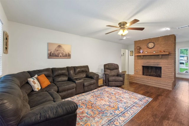 24 Wagon Lane Loop, Angleton, TX 77515 - living room with a ceiling fan, wood finished floors, a fireplace, and baseboards