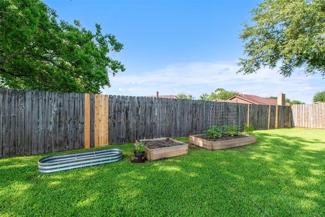 24 Wagon Lane Loop, Angleton, TX 77515 - view of yard featuring a garden