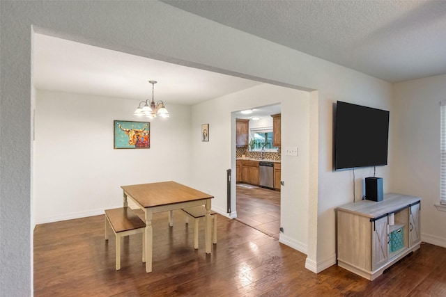 24 Wagon Lane Loop, Angleton, TX 77515 - dining room featuring dark wood finished floors, a chandelier, and baseboards