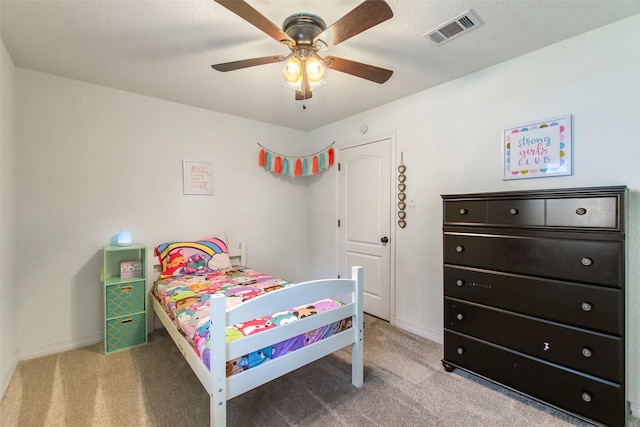 24 Wagon Lane Loop, Angleton, TX 77515 - carpeted bedroom with baseboards and ceiling fan