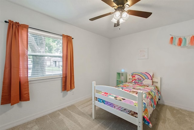 24 Wagon Lane Loop, Angleton, TX 77515 - bedroom with carpet, a ceiling fan, and baseboards