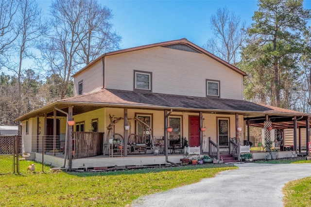 12857 Fm 1485th Rd, Conroe, TX 77306 - farmhouse-style home with a porch and a front lawn