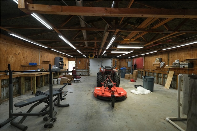 915 Live Oak Dr, Jones Creek, TX 77541 - garage featuring a workshop area and wood walls