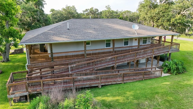 915 Live Oak Dr, Jones Creek, TX 77541 - back of property with a shingled roof, a yard, and a wooden deck