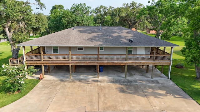 915 Live Oak Dr, Jones Creek, TX 77541 - view of front of property featuring a shingled roof, driveway, a front lawn, and view of scattered trees