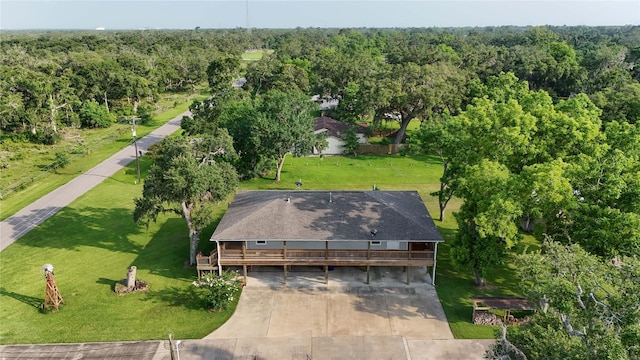 915 Live Oak Dr, Jones Creek, TX 77541 - view of subject property with a heavily wooded area