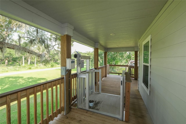 915 Live Oak Dr, Jones Creek, TX 77541 - wooden porch featuring a lawn