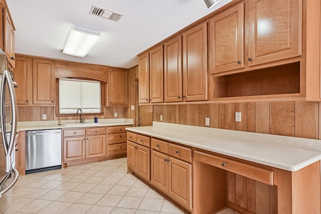 2920 Heron Dr, Galveston, TX 77551 - kitchen with appliances with stainless steel finishes, a sink, light tile patterned floors, light countertops, and open shelves