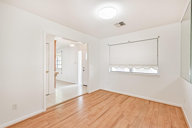 2920 Heron Dr, Galveston, TX 77551 - spare room with baseboards and hardwood / wood-style floors