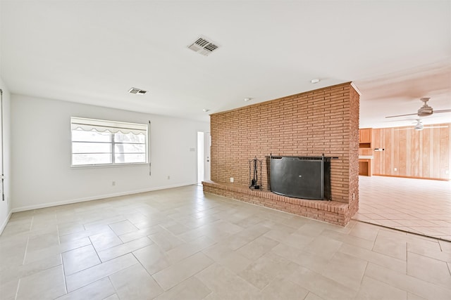 2920 Heron Dr, Galveston, TX 77551 - unfurnished living room featuring light tile patterned flooring, a fireplace, a ceiling fan, and baseboards
