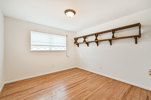 2920 Heron Dr, Galveston, TX 77551 - empty room with light wood-type flooring and baseboards