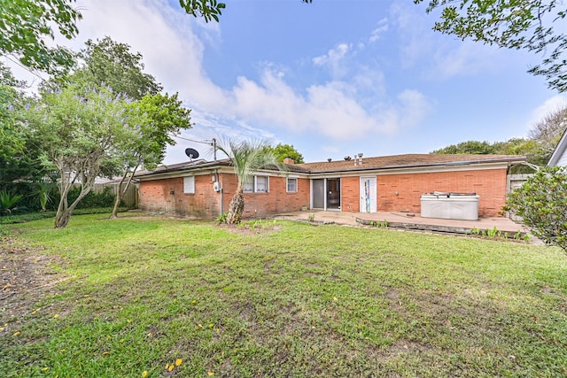 2920 Heron Dr, Galveston, TX 77551 - view of front facade featuring a patio area and brick siding