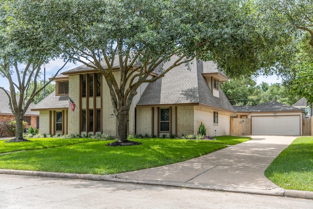 15735 Mesa Gardens Dr, Houston, TX 77095 - view of front of property featuring a front yard, concrete driveway, brick siding, and roof with shingles