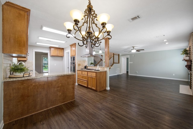 15735 Mesa Gardens Dr, Houston, TX 77095 - kitchen with a peninsula, dark wood-type flooring, decorative backsplash, and a chandelier