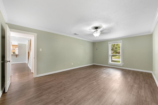 15735 Mesa Gardens Dr, Houston, TX 77095 - spare room featuring dark wood-type flooring, a ceiling fan, baseboards, and crown molding