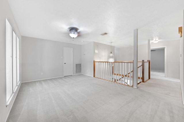 15735 Mesa Gardens Dr, Houston, TX 77095 - empty room featuring light colored carpet, ceiling fan, and baseboards