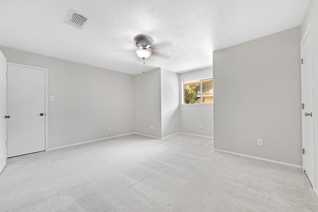 15735 Mesa Gardens Dr, Houston, TX 77095 - unfurnished room with ceiling fan, light carpet, and baseboards