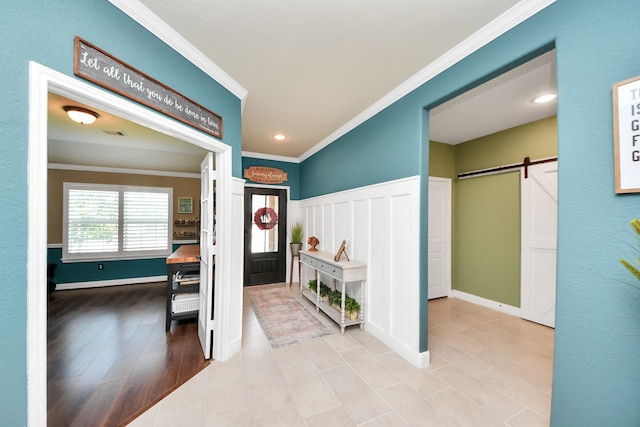 5131 Kingship Ct, Katy, TX 77493 - tiled foyer entrance featuring a barn door, crown molding, recessed lighting, and baseboards