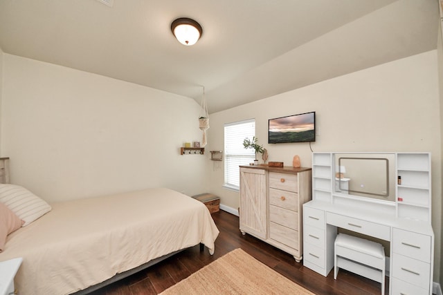 5131 Kingship Ct, Katy, TX 77493 - bedroom featuring dark wood-type flooring, lofted ceiling, and baseboards