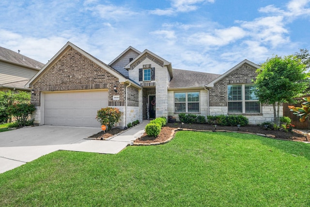 5131 Kingship Ct, Katy, TX 77493 - view of front of house featuring stone siding, concrete driveway, a garage, a front lawn, and a shingled roof