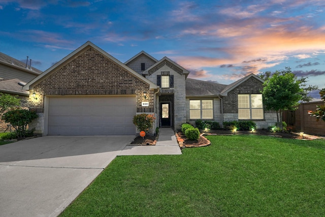 5131 Kingship Ct, Katy, TX 77493 - traditional-style home featuring stone siding, an attached garage, concrete driveway, and a front yard