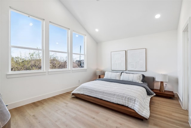 612 Hughes St Unit B, Houston, TX 77023 - bedroom with multiple windows, lofted ceiling, wood finished floors, baseboards, and recessed lighting