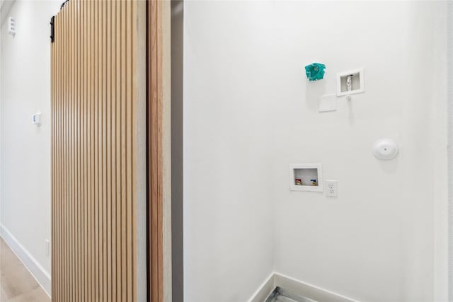612 Hughes St Unit B, Houston, TX 77023 - laundry room with washer hookup and baseboards
