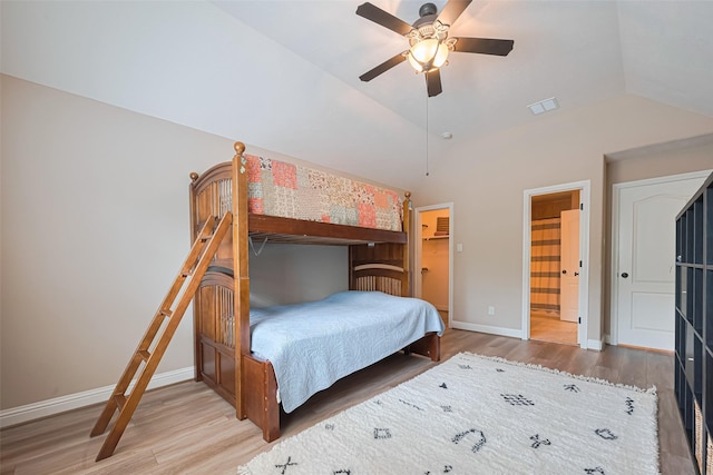 1623 Whitfield St, Sugar Land, TX 77479 - bedroom featuring wood finished floors, baseboards, vaulted ceiling, ensuite bathroom, and a ceiling fan