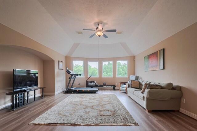 1623 Whitfield St, Sugar Land, TX 77479 - living area featuring ceiling fan, wood finished floors, a tray ceiling, and baseboards