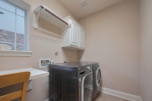 1623 Whitfield St, Sugar Land, TX 77479 - laundry area with cabinet space, washer and clothes dryer, and baseboards