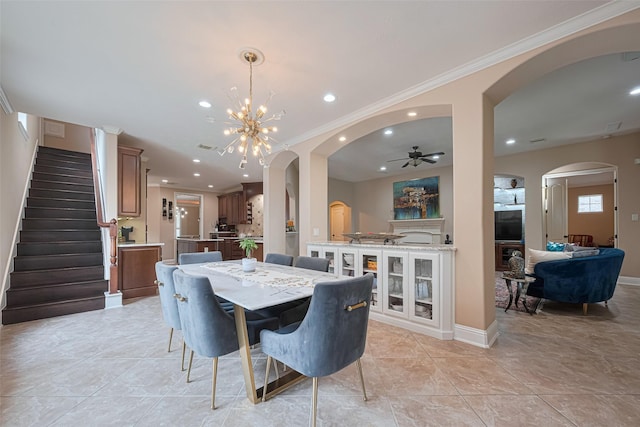 1623 Whitfield St, Sugar Land, TX 77479 - dining space featuring arched walkways, stairway, recessed lighting, a chandelier, and ceiling fan