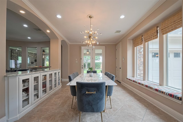 1623 Whitfield St, Sugar Land, TX 77479 - dining room featuring arched walkways, a chandelier, light tile patterned flooring, recessed lighting, and baseboards